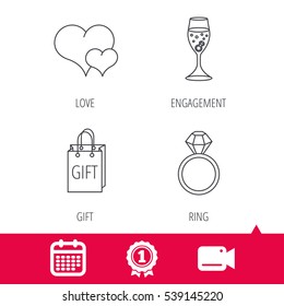 Achievement and video cam signs. Love heart, gift bag and wedding ring icons. Engagement linear sign. Calendar icon. Vector