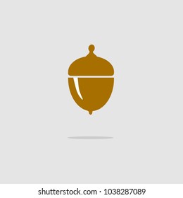 Acorn badge with shadow. Plane vector illustration on gray background for design concept.Acorn badge with shadow.