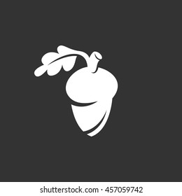 Acorn vector logo isolated on a black background. Icon silhouette design template. Simple symbol concept in flat style. Abstract sign, pictogram for web, mobile and infographics