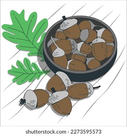 acorns and oak leaves on burlap texture background. autumn time concept. fall harvest season. Close up view of seasonal autumn acorn