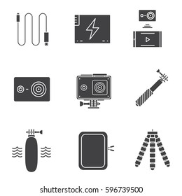 Action camera glyph icons set. Silhouette symbols. Sport cam, usb cable, battery, phone connection, waterproof case, selfie monopod stick, floating grip, box, tripod. Vector isolated illustration