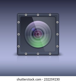Action camera in a protective housing with bolts. Professional photo lens.