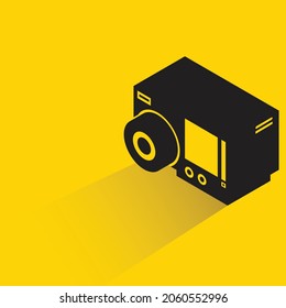 action camera with shadow on yellow background