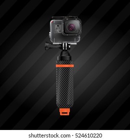 Action video camera 5 for filming extreme sports in waterproof box on floating selfie stick