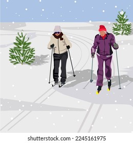 Active elderly women on skis move along the ski track at training in the winter forest during a snowfall