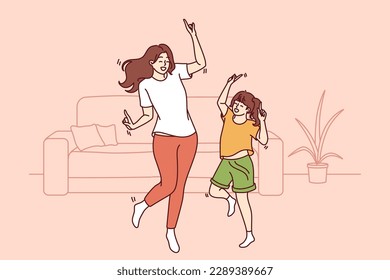 Active family of dancing young mother and daughter enjoying movement to music. Dance of teenage girl, elementary school student and mother or older sister dancing together spending free time 