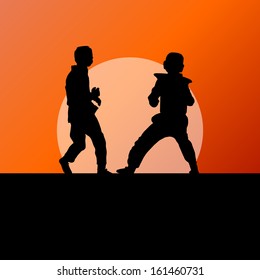 Active tae kwon do martial arts fighters combat fighting and kicking sport silhouettes in abstract sunset illustration background vector