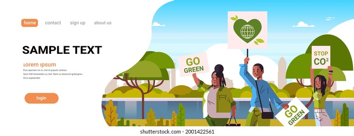 activists holding posters go green save planet strike concept protesters campaigning to protect earth demonstrating against global warming portrait cityscape background copy space horizontal