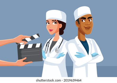 Actors Wearing Scrubs Filming Medical TV Show

Tv Show staff producing a medical drama soap opera program 
