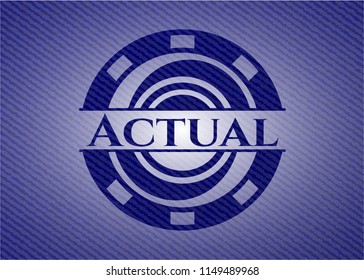 Actual badge with denim background