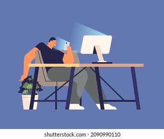 addicted man using digital gadget guy active in social networks at workplace digital addiction concept