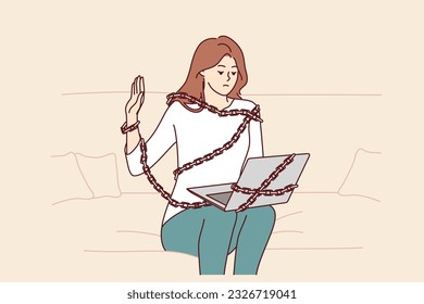 Addicted woman with laptop sits on couch chained for internet dependent concept. Addicted freelance girl working from home suffers from work overload and strict deadlines causing problems
