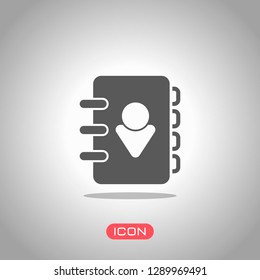 address book with person on cover. simple icon. Icon under spotlight. Gray background
