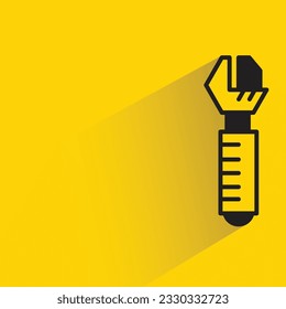 adjustable wrench with shadow on yellow background