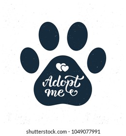 Adopt me - hand lettering in the pawprint. Isolated on white textured background. Vector illustration.