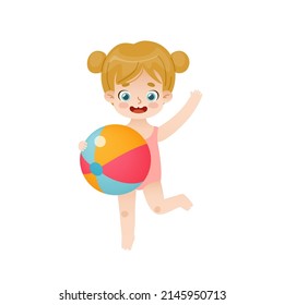 Adorable baby girl jumping with beach ball. Cute kid playing with inflatable ball on summer vacations.