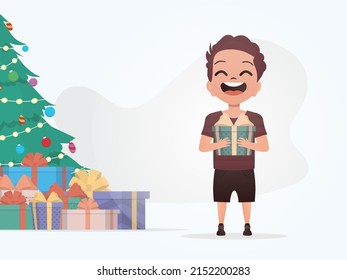 Adorable baby stands in full growth and holds a box with a bow in his hands. New Year. Cartoon style. Vector illustration