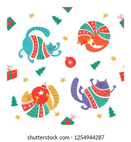 Adorable Christmas cats in warm sweaters. Hand drawn characters, Christmas decorations and Christmas trees. Seamless vector pattern.