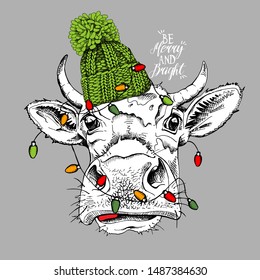 Adorable Cow in a green knitted hat and with a light. Be merry and bright - lettering quote. Christmas and New year card, Humor composition, hand drawn style print. Vector illustration.