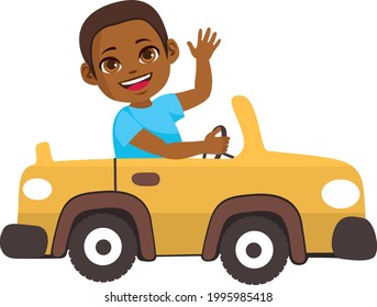 Adorable cute little black boy driving yellow car toy