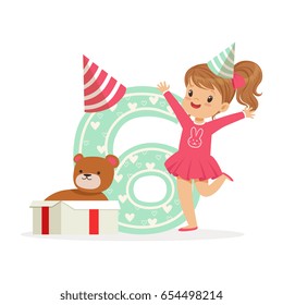 Adorable happy six year old girl in a party hat celebrating her birthday, colorful cartoon character vector Illustration