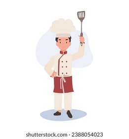 Adorable Little Chef Boy in Apron. Smiling Child Chef with Flipper