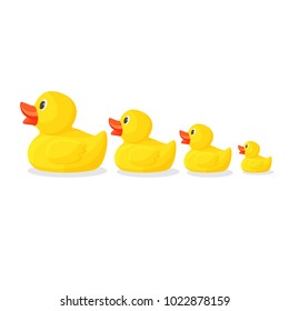 Adorable rubber ducks in row from big to small