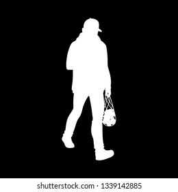 Adult man in warm jacket and baseball cap walking. White silhouette isolated on black background. Front view. Monochrome vector illustration of man returns from supermarket with a package of fruit