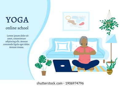Adult plump woman, grandmother doing yoga at home using a laptop. Online yoga school concept. Place for text