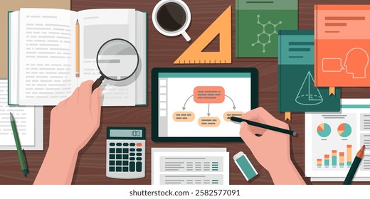 Adult student sitting at his desk and preparing for the exam, top view: learning and education concept