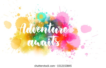 Adventure awaits - inspirational handwritten modern calligraphy lettering text on abstract watercolor paint splash background.