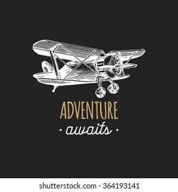 Adventure awaits motivational quote. Vintage retro airplane logo. Vector typographic inspirational poster. Hand sketched aviation illustration in engraving style. 