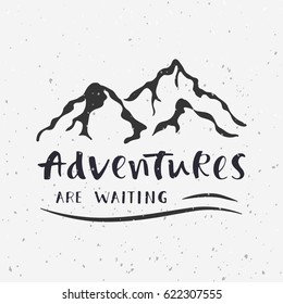 Adventures are waiting. Handwritten lettering for cards, posters and t-shirts. Outdoor vector illustration with quote and mountains silhouette.