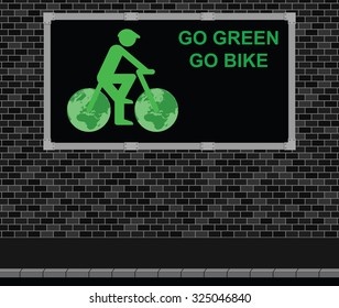 Advertising board on brick wall advertising Go Green Go Bike