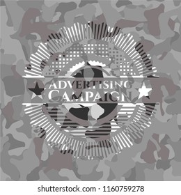 Advertising Campaign written on a grey camouflage texture
