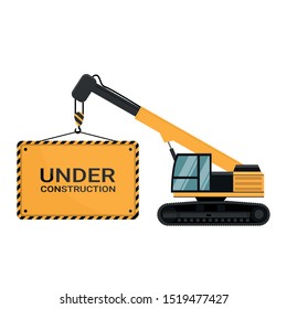 Advertising poster under construction loaded by a heavy crane caterpillar machinery