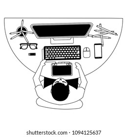 aerial view of graphic designer working with computer