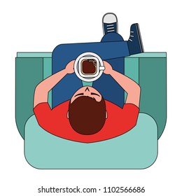 aerial view of young man sitting in sofa with cross leg and cup coffee