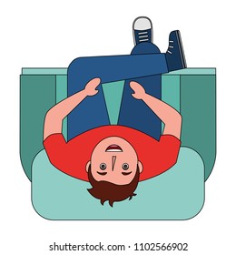 aerial view of young man sitting in sofa with cross leg