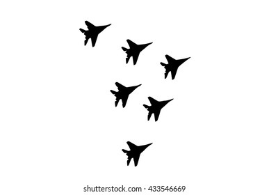 Aerobatic team perform fighter flying at an Airshow. Silhouette.