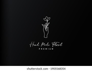 Aesthetic hand botanic logo design. Vector illustration of hand holding nature botanic. Modern vintage icon design template with line art style.