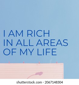 affirmation quote design reads "i am rich in all areas of my life"