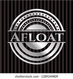 Afloat silvery emblem