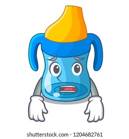 Afraid cartoon baby drinking from training cup