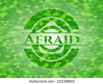 Afraid green emblem. Mosaic background
