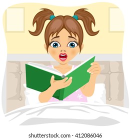 Afraid little girl reading book indoors in bedroom