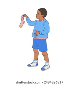 African American boy holding a sock in his hands	
