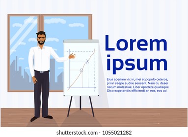 African American Business Man Leading Presentation Showing Data On Flip Chart Board In Office