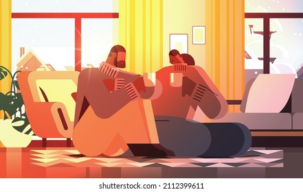 african american couple drinking coffee and talking together at home living room interior horizontal