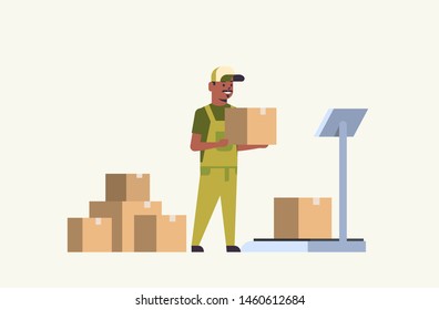 african american courier man in uniform putting parcel box on scales mail express delivery logistic service concept flat horizontal full length